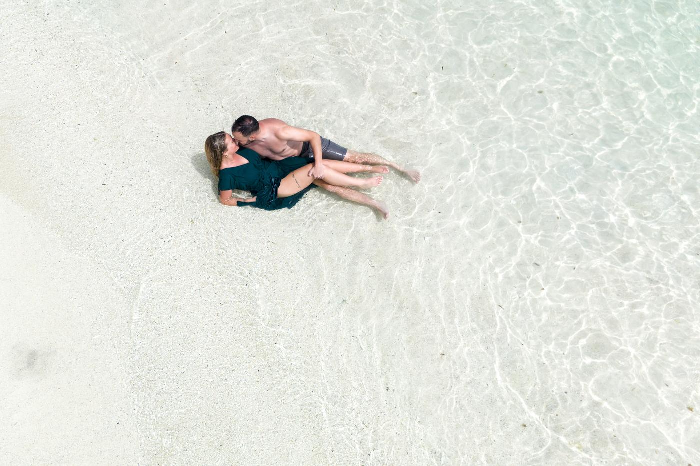 Aerial couple floating shallow lagoon mauritius