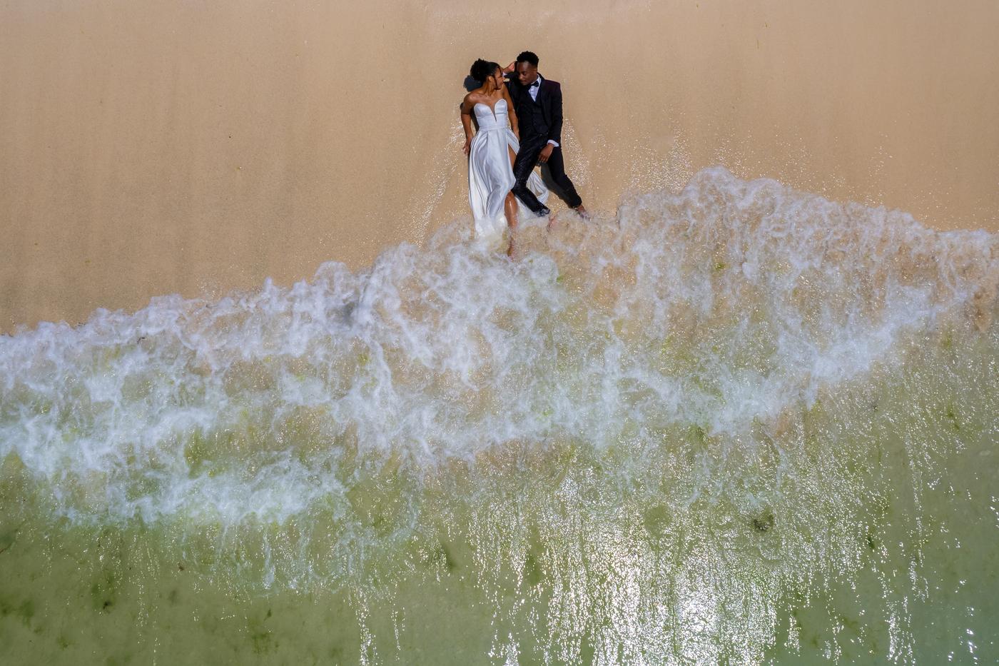 Aerial couple standing in shore break mauritius
