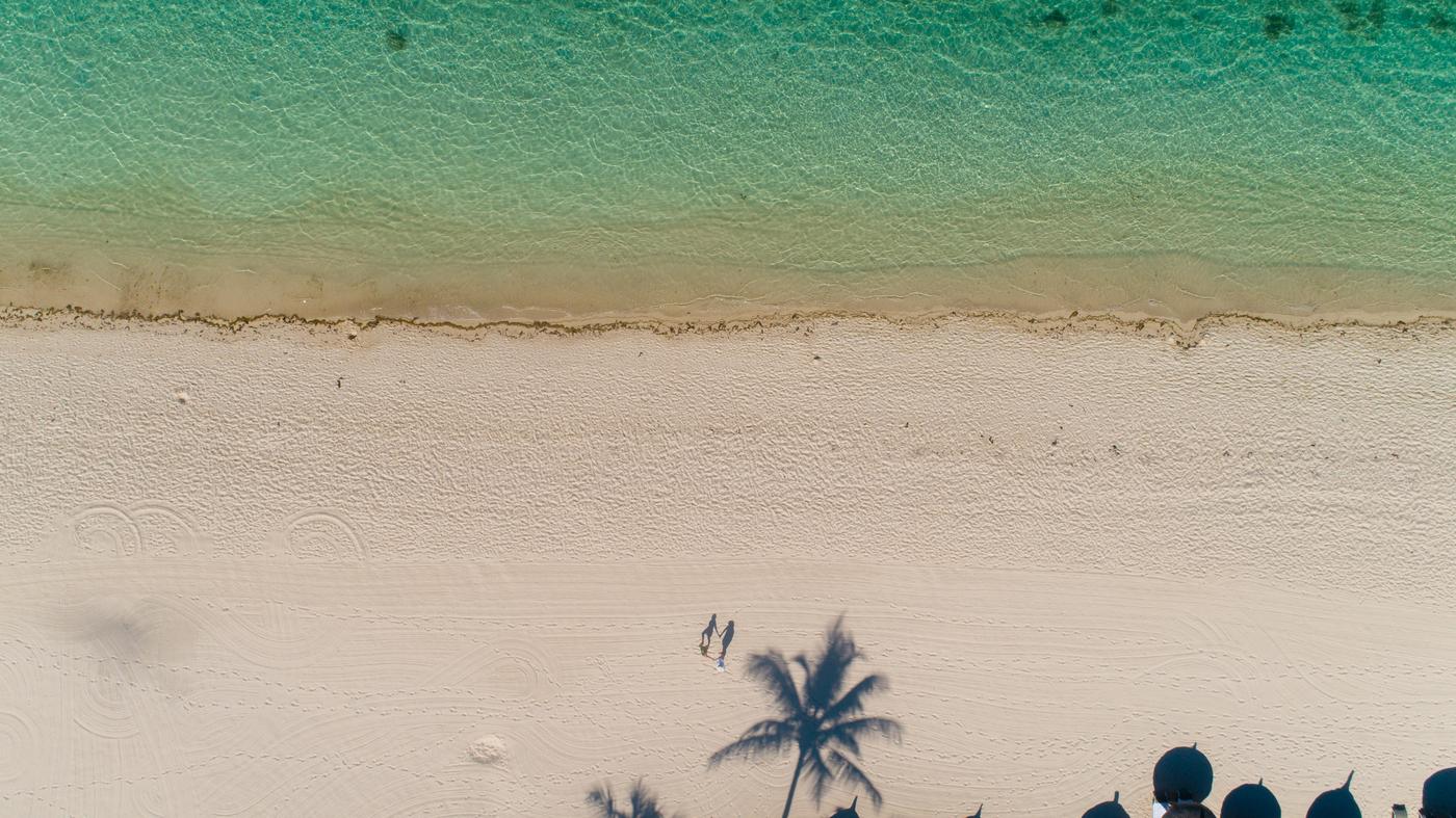 Aerial empty sand beach turquoise water mauritius
