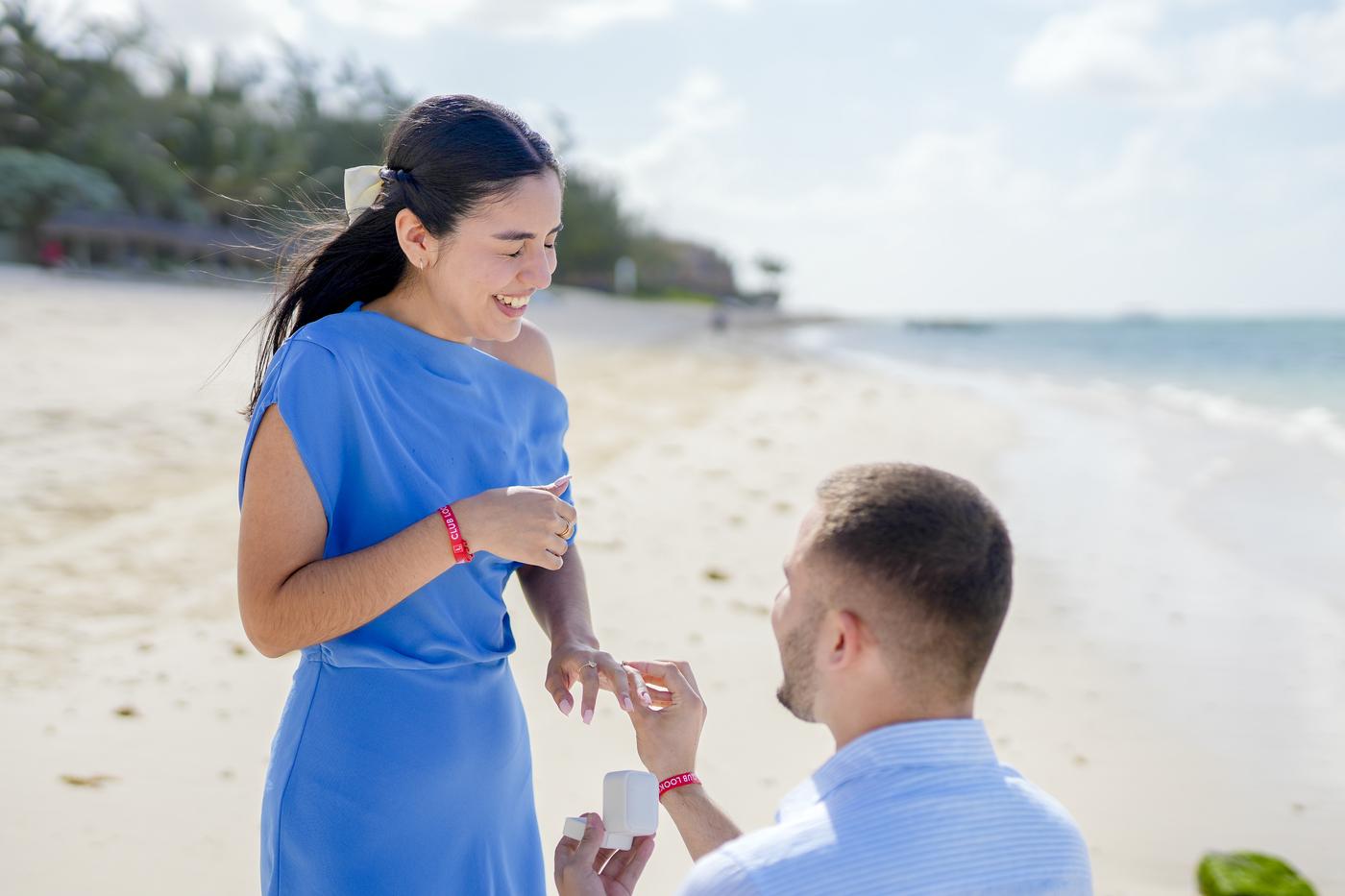 Beach proposal woman blue dress ring mauritius