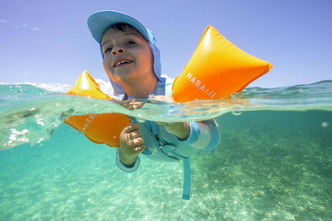 Child floating swim aids turquoise water mauritius