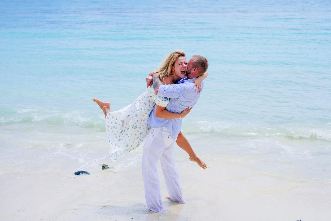 Couple playful romantic beach lift mauritius