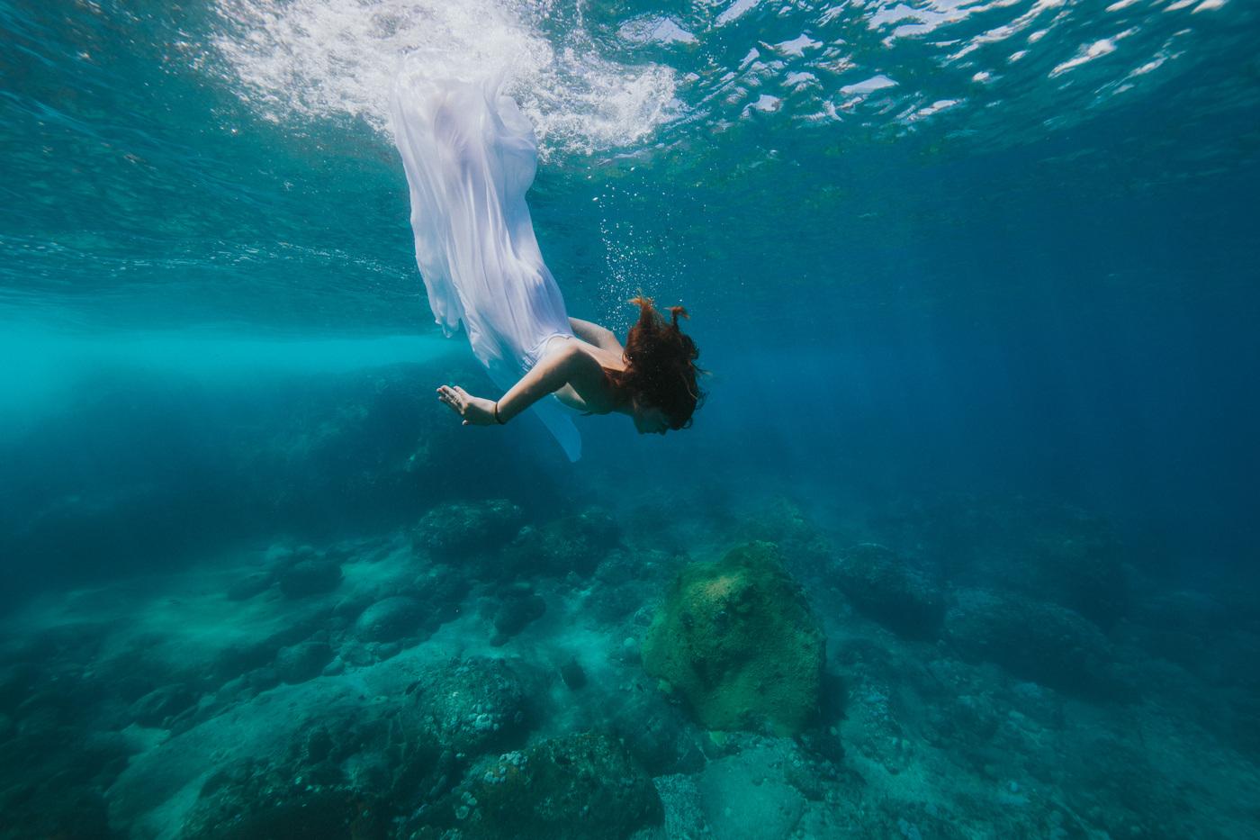 Underwater woman swimming clear blue sea mauritius