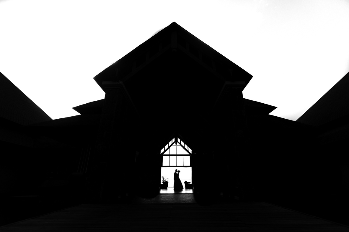 Bride and groom silhouetted in a Mauritius chapel