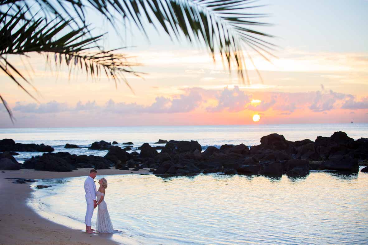 Bride and groom at sunset on a Mauritius beach